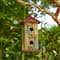 Glitzhome® 11.75" Yellow Washed 3D Metal Flowers Distressed Wood Cottage Birdhouse